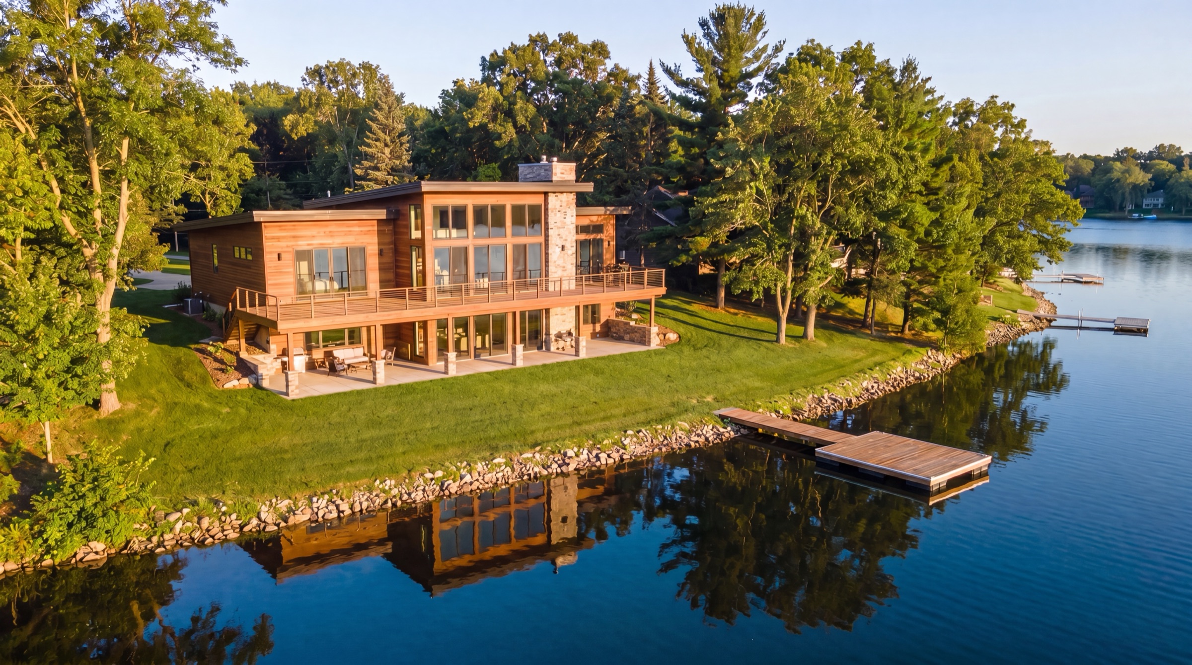 Aerial drone photo of a contemporary lake home